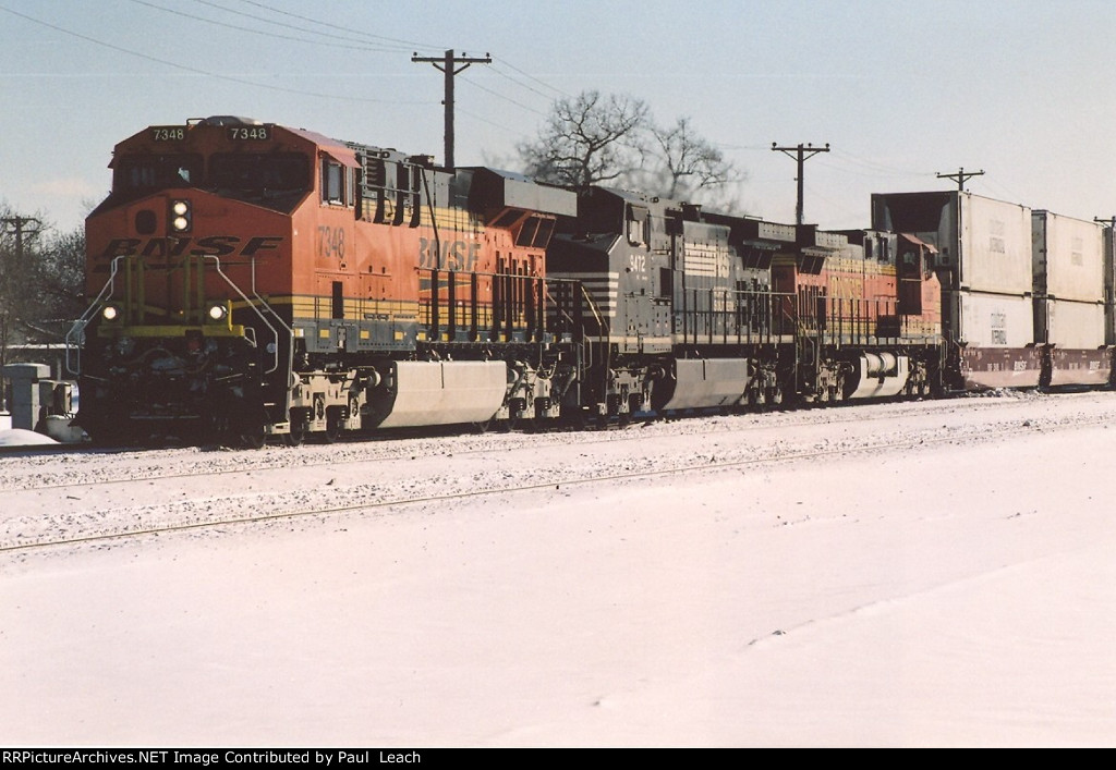 Stack train rolls west through University